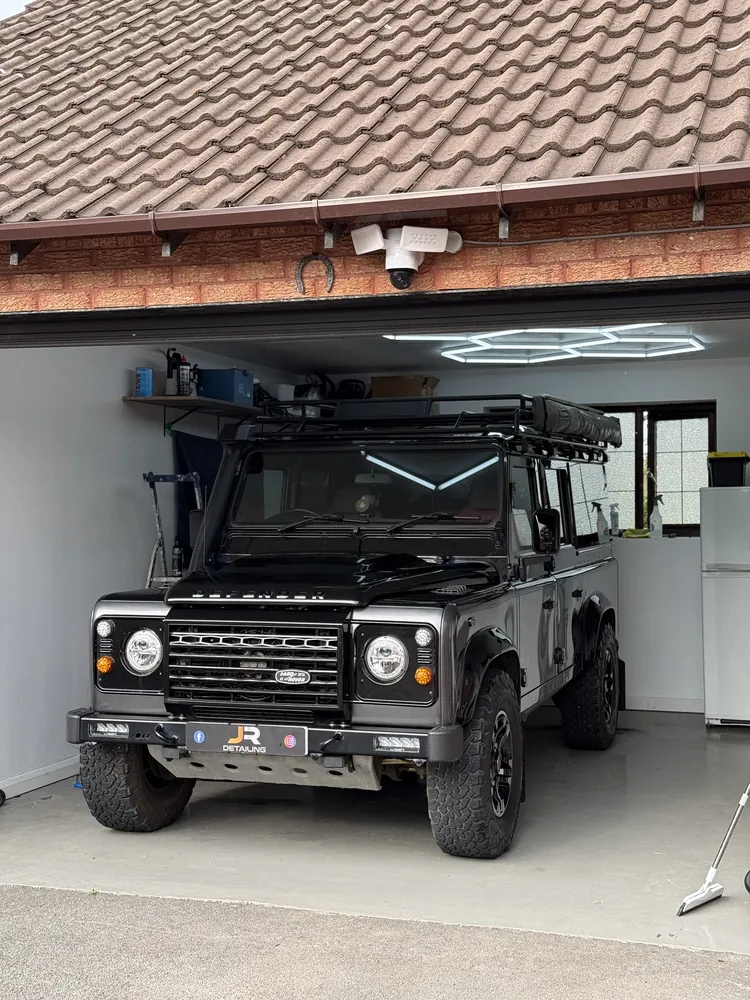 Black Land Rover Defender in the J.R Detailing unit